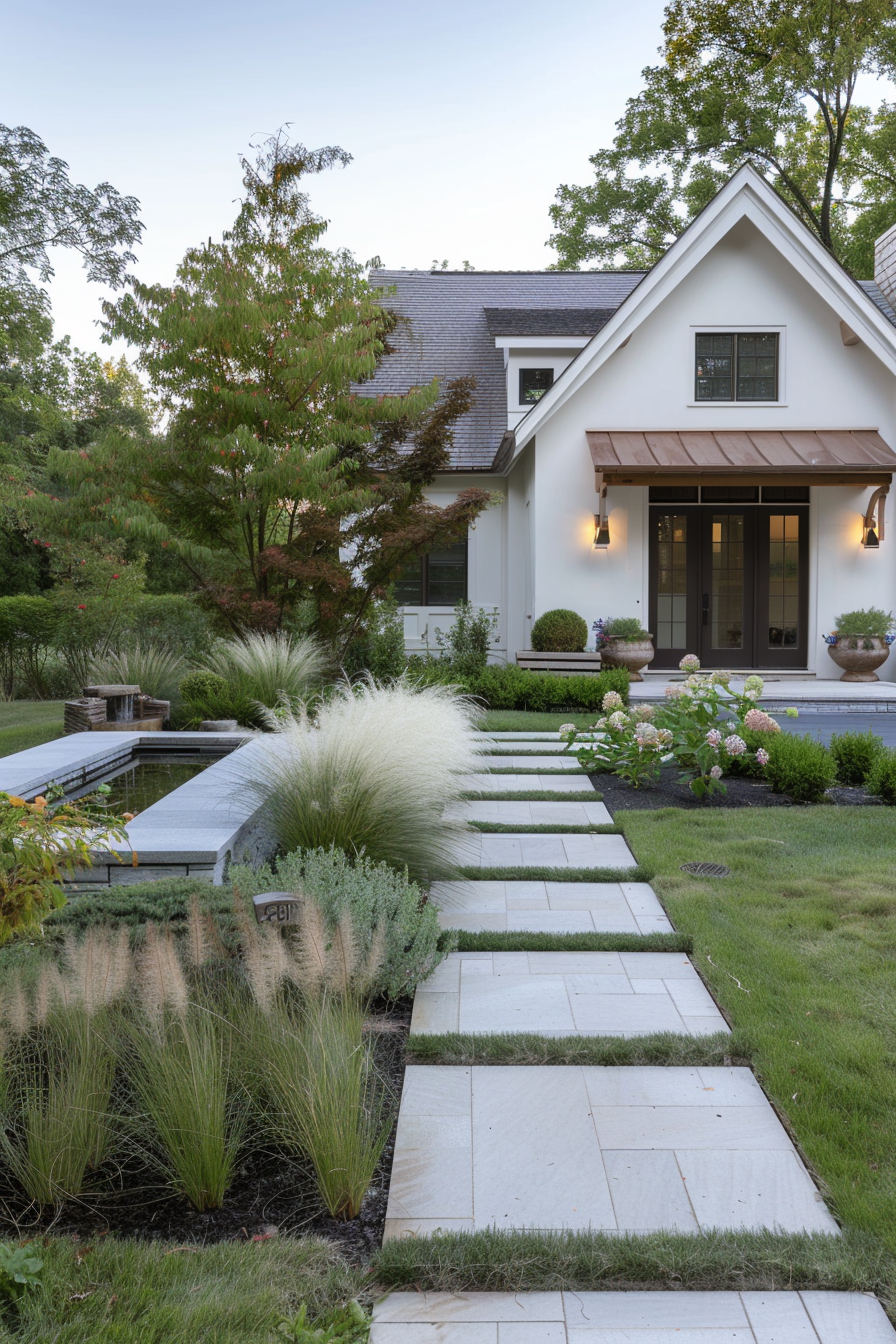 Front yard with a stone pathway, boxwoods, and ornamental grasses.