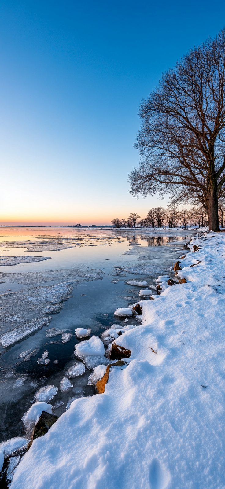 peaceful winter sunrise over a frozen lake