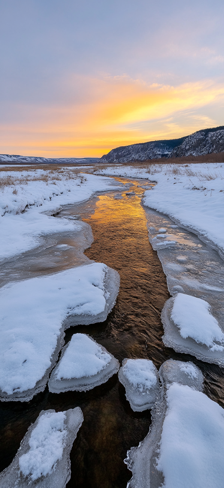 icy river winding through snow-covered landscape