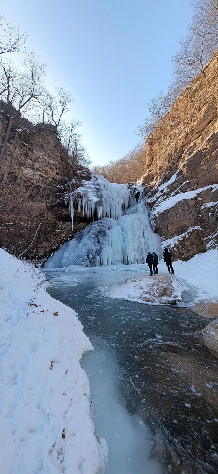 stunning frozen waterfall in winter landscape