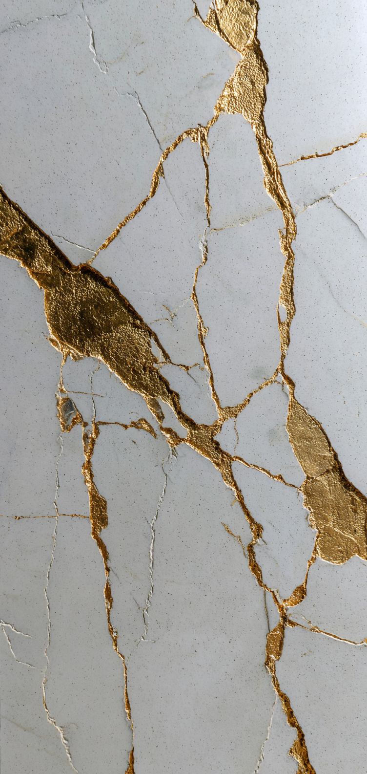 White porcelain with gold kintsugi cracks