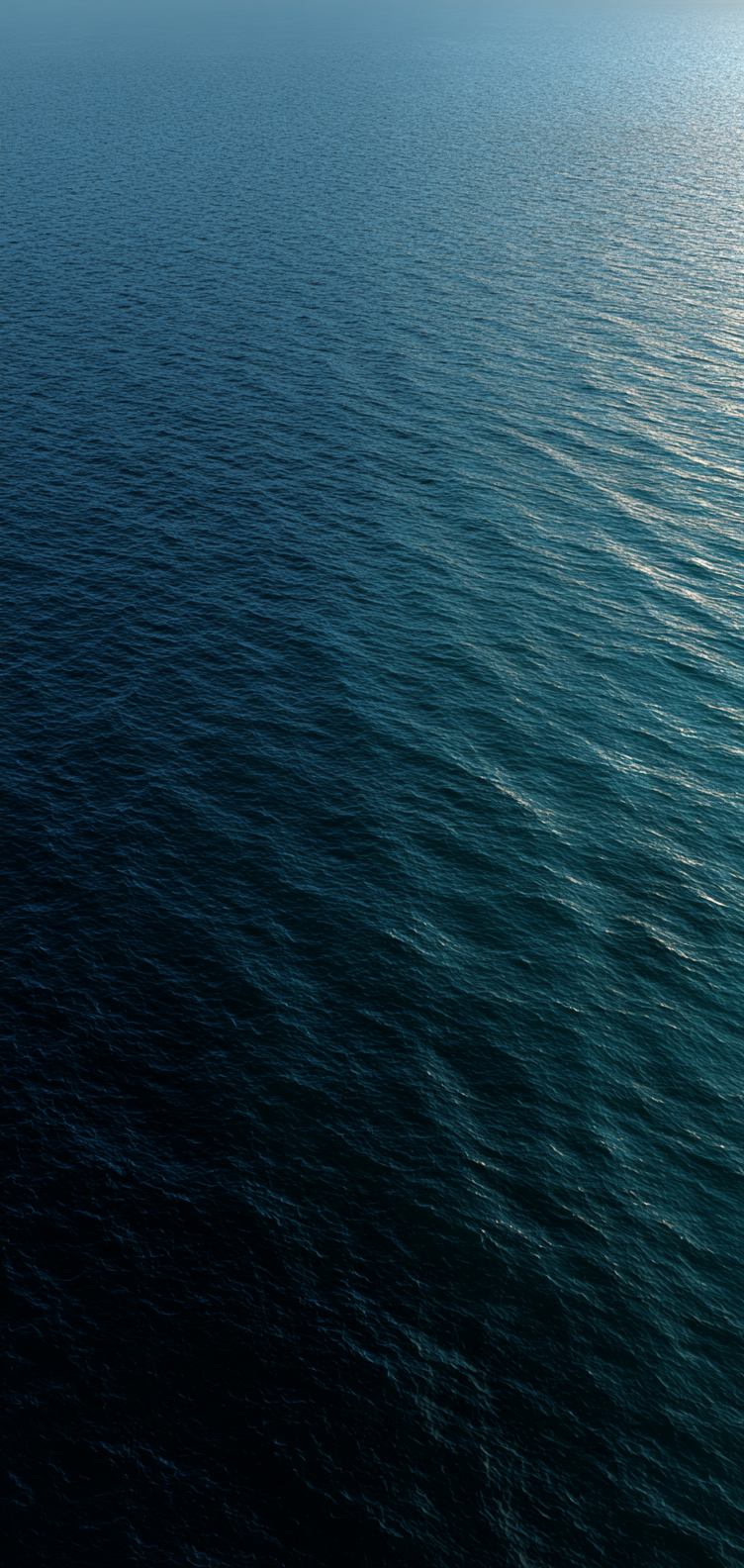 Aerial ocean ripples in teal and blue