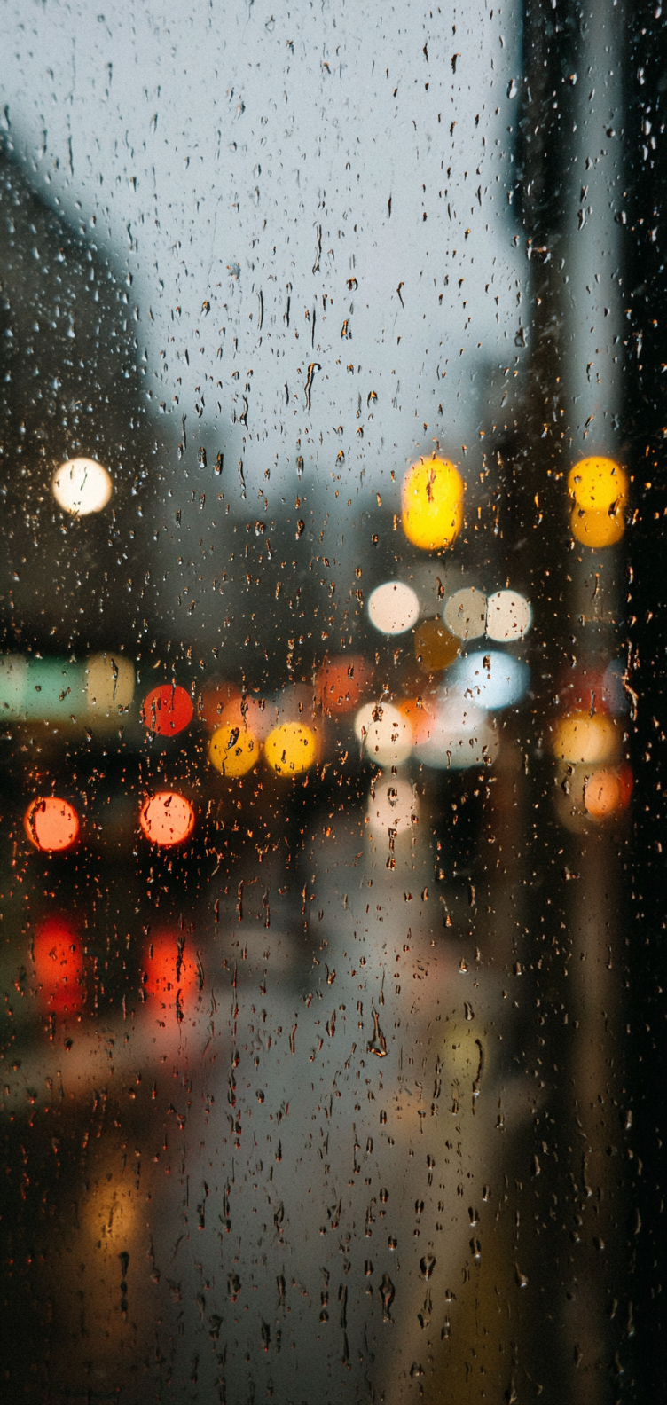 Water droplets with blurred city lights