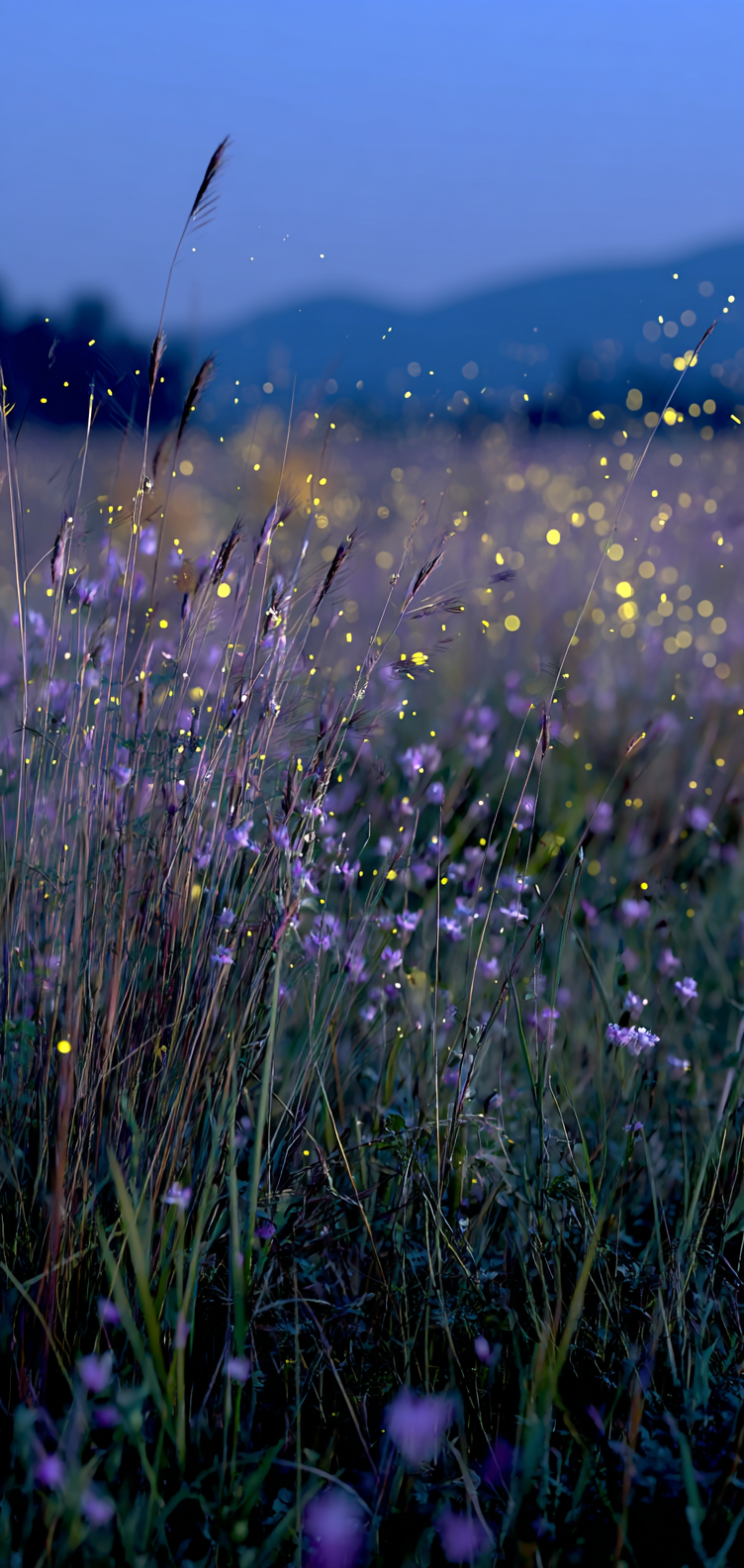 Moody blue-violet sky with fireflies